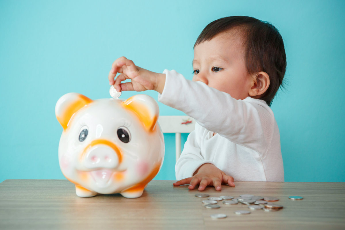 Baby with piggy bank