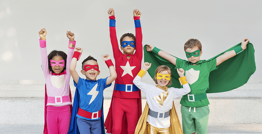 group of young children dressed as superheroes