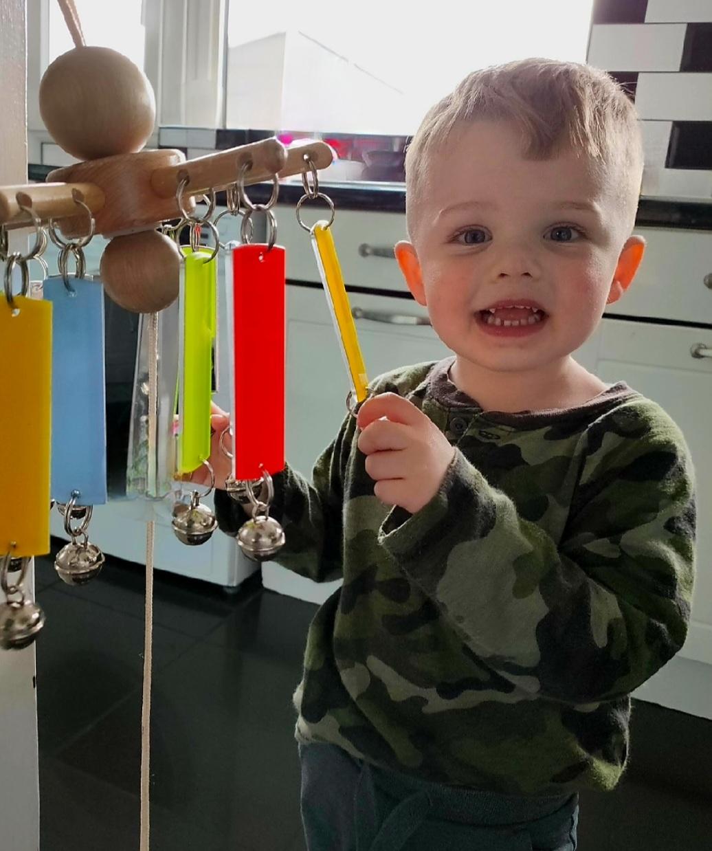 Thomas playing with a sensory toy