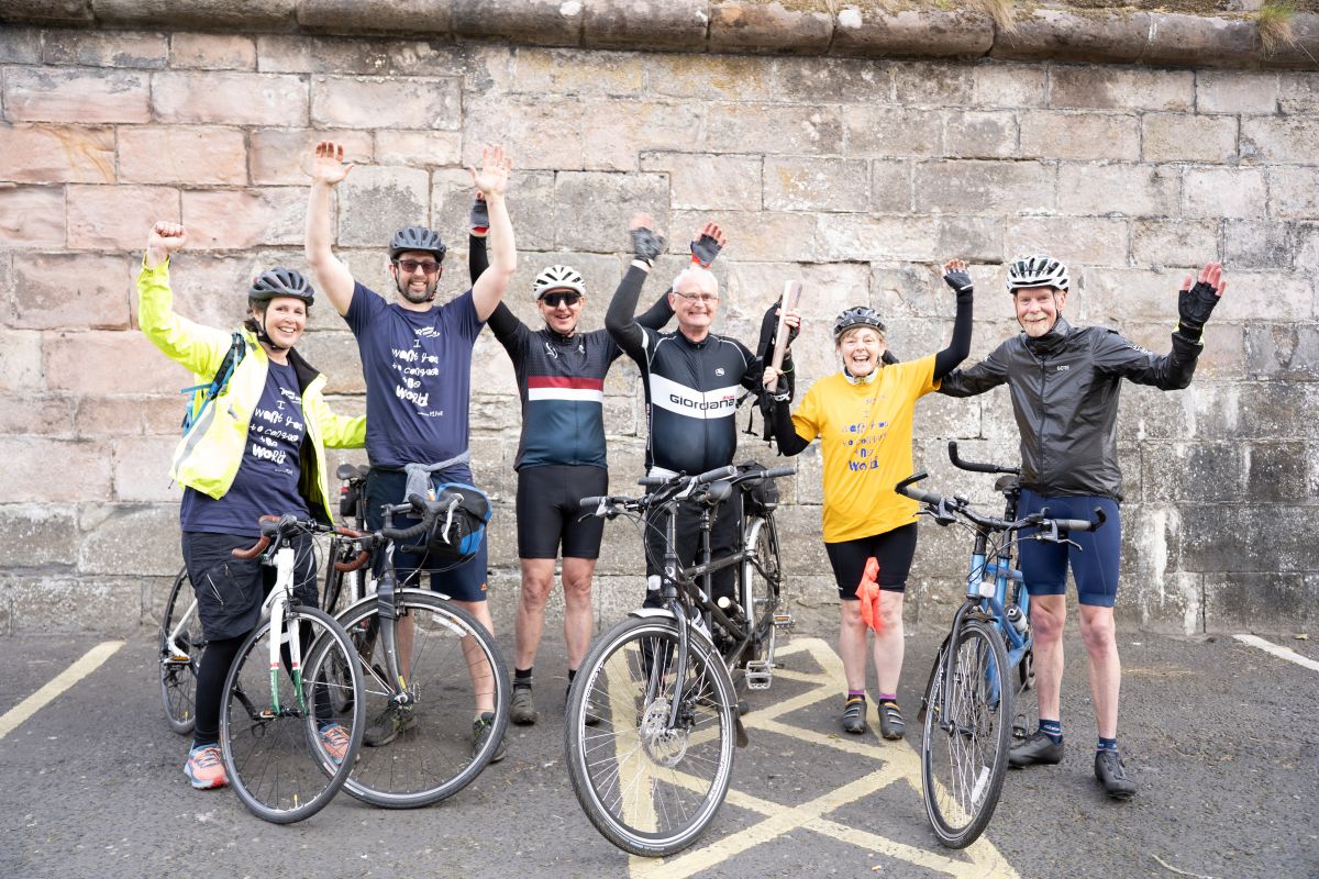 Two sets of tandem bikers from In-Tandem East Lothian with their tandem bikes, and Cerebra CEO Jess Camburn-Rahmani and her brother Mark