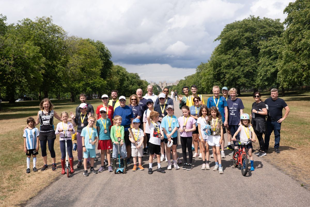 Children and adults wearing Relay medals on the long walk at Windsor