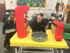 Children playing with musical instrument