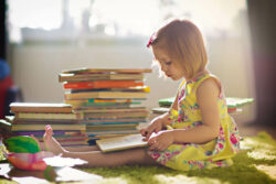 Cerebra library a child reading books.
