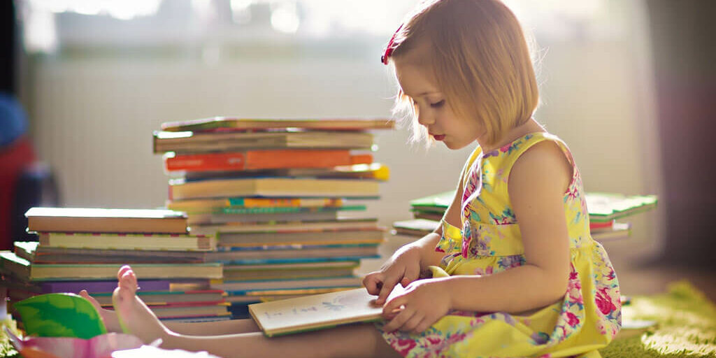 Cerebra library a child reading books.