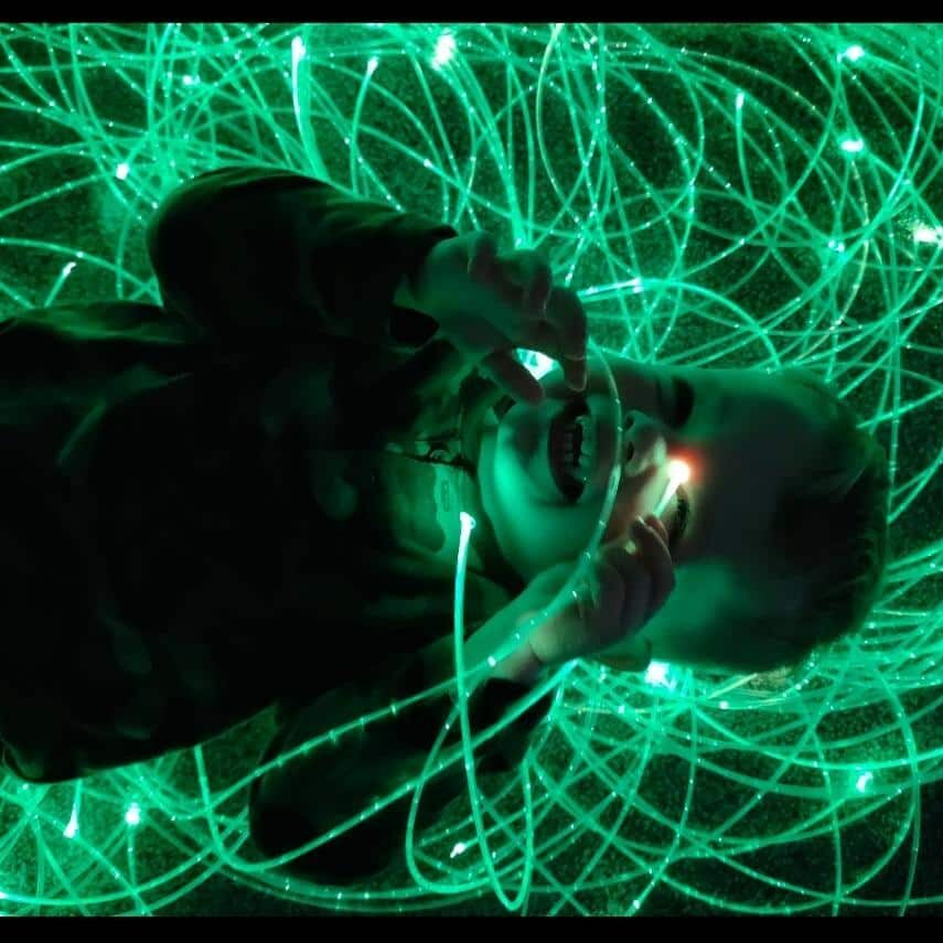 Thomas playing with fibre optic lights