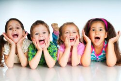 four excited children in a row