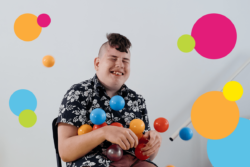 disabled boy smiling with ball pool balls